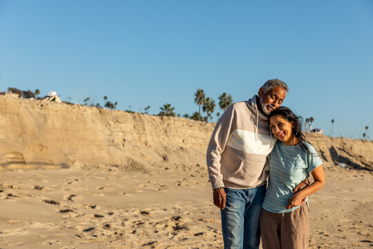 Couple Embraces On the Beach