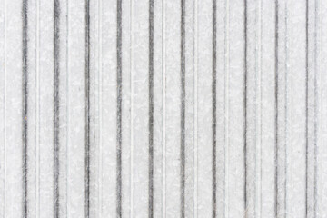 Corrugated metal sheet background. Grunge old grainy metal texture. Silver color industrial pattern. Garage construction gray striped wall.