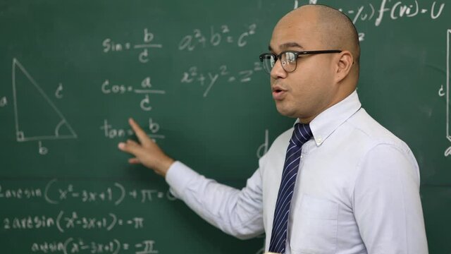 Young asian teacher man teaching video conference with student. Male Indian teacher training the mathematics in classroom from online course.