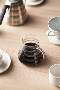 Jug of coffee near cups