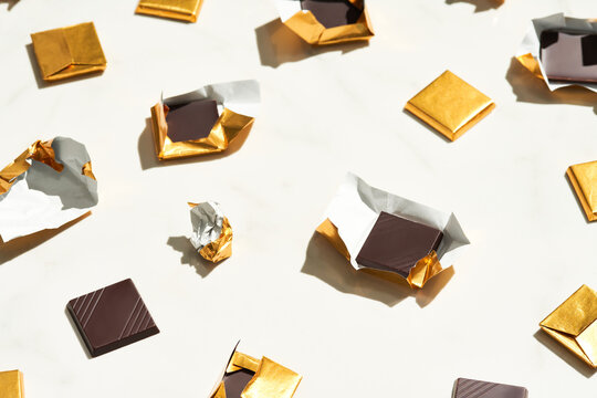 Pieces of chocolate and golden foil