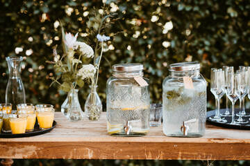 lemonade jars with dispenser on a rustic wooden table