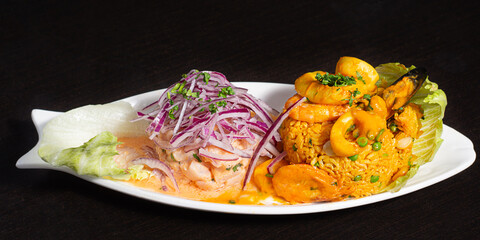 Peruvian traditional food. Ceviche and seafood with rice. Ceviche y Arroz con mariscos