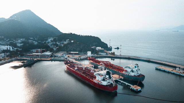 Mexican port in Manzanillo - two large ocean cargo ships near the dock