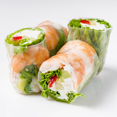 appetizing spring rolls with sea food and philadelphia cheese on a white background