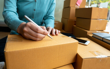 Small Entrepreneurs Start A Home Business By Arranging Goods With Brown Parcel Boxes, Small Home Business Startup Ideas.