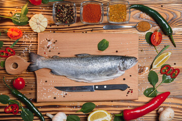 fresh trout with spices and seasonings top view, flat lay