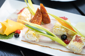 details of delicious outdoor brunch on black wooden table
