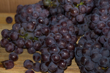 Fototapeta premium Bunch of purple grapes. Purple grapes also used in the manufacture of some types of wine.