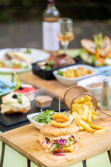 details of tasty hamburger, at restaurant, outside