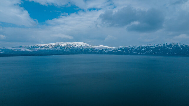 Sevan lake and a snowy mountain chain