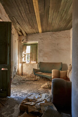 interior of a peasant house that has been disused for years and decadent