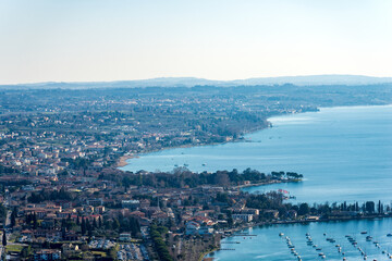 Fototapeta premium Aerial view of the Lake Garda (Lago di Garda) with the small villages of Bardolino, Cisano and Lazise, view from the Rocca di Garda, small hill overlooking the lake. Verona province, Veneto, Italy, Eu