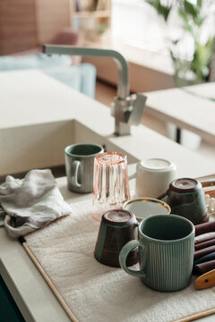 Washed dinnerware on the table.