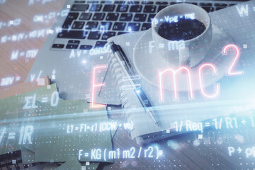 Double exposure of formula drawing and desktop with coffee and items on table background. Concept of education