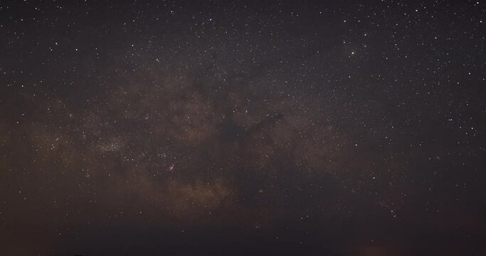 The Milky Way and Clouds in a Night Sky (Timelapse)