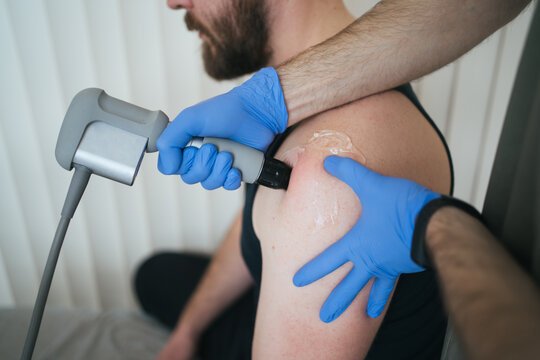 Doctor conducts treatment with patient in hospital