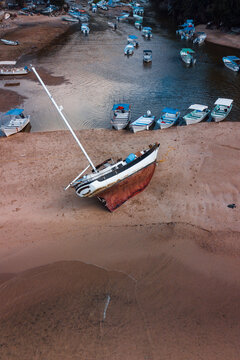 overhead view of a lonely yacht on the coast