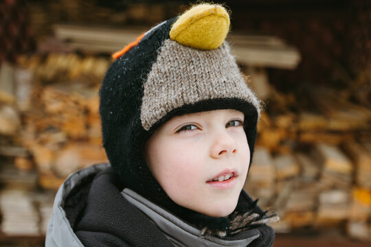 A child plays outside in winter.