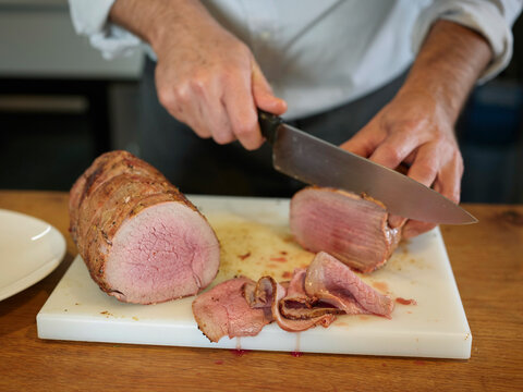 Chef slicing meat