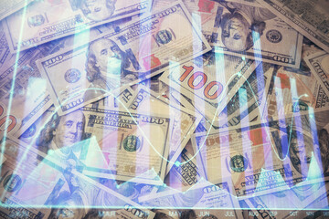 Multi exposure of forex chart drawing over us dollars bill background. Concept of financial success markets.