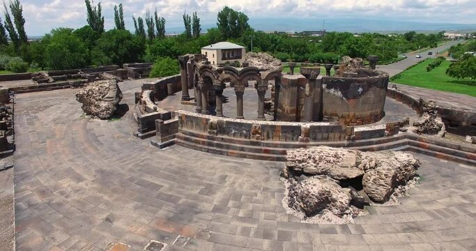 Aerial view ancient columns of Zvartnots (celestial angels) temple, Armenia. Central Asia, Unesco heritage site. Drone fly from Ruins of Zvartnots.