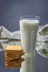 Milk in transparent glasses and cookies