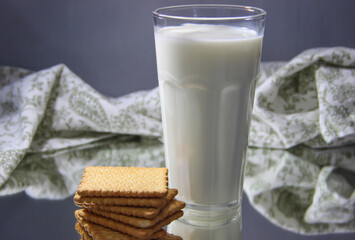 Milk in transparent glasses and cookies