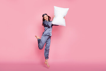 Full length body size photo of girl in sleepwear laughing fighting with pillow on pajama party...