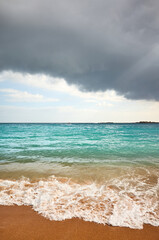 Stormy clouds over a tropical beach.