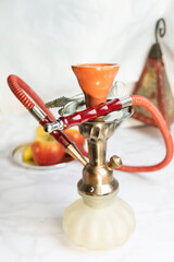 Glass arabian smoking hookah shisha  with apple flavor on a white background