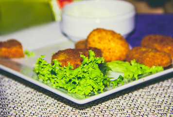 Fried chicken and greens on a plate