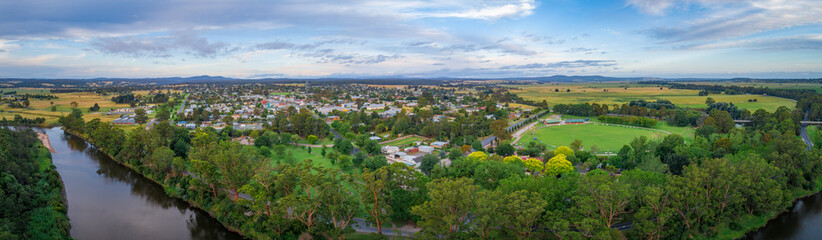 Wide aerial panorama of Orbost town nested near Snowy River in Victoria, Australia - 420744890