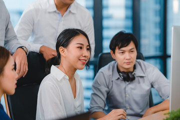 Collaborative process of multicultural businesspeople using computer presentation and communication meeting brainstorming ideas about project colleagues working plan success strategy in modern office.