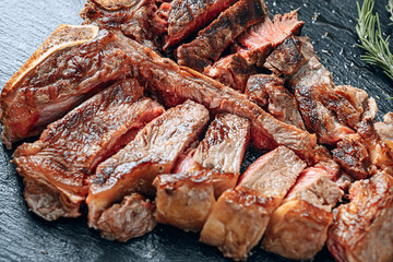 fried t-bon steak medium rare close-up