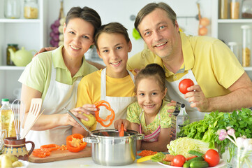 Cute family cooking together in kitchen