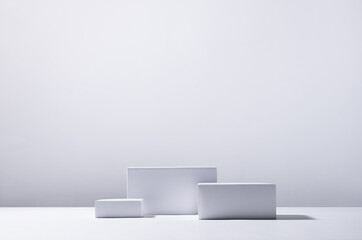 Minimalist abstract design for presentation and product display - white square podiums as winner in...