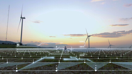 Futuristic engineer working on wind farm on sunset using nano technology with 3d model construction...