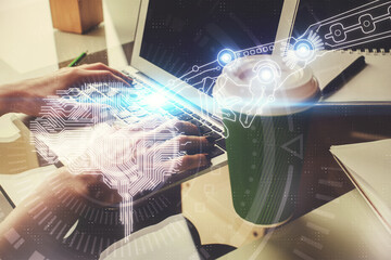 Double exposure of woman hands working on computer and brain hologram drawing. Ai concept.