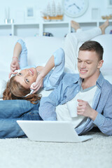 handsome young man  and woman  with laptop