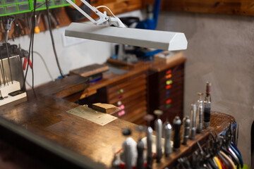 table and tools of a jewelry workshop, jeweler craftsman.