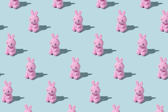 Easter pattern made with easter bunny on blue background. Creative minimal holiday concept. Flat lay, top view