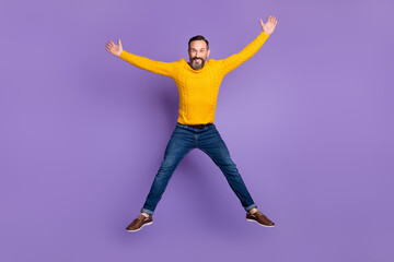Fototapeta na wymiar Full body photo of cheerful person jumping make star figure beaming smile isolated on violet color background