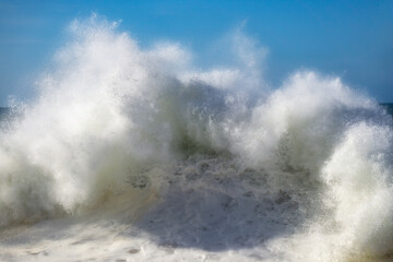 big brake breaking on the beach shore