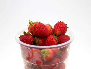 strawberry in a plastic clear Cup