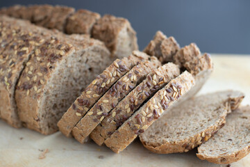 Bread with seeds on a wooden board