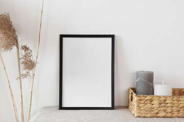 Black frame with candle and cane