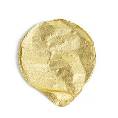 round golden aluminum thin lid for plastic yogurt jars on a white background