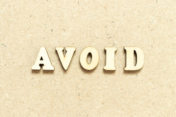 Alphabet letter in word avoid on wood background