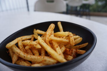 The view from above the french fries snack on the white table.
